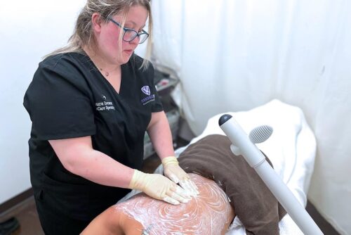 Shore skin care student working on client