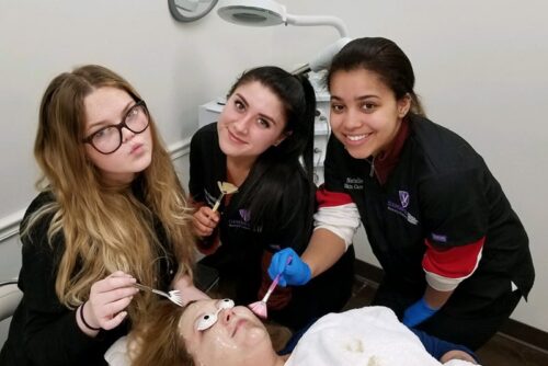 Shore skin care students practicing on client